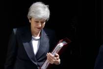 Britain's Prime Minister Theresa May leaves 10 Downing Street to attend the weekly session of P ...
