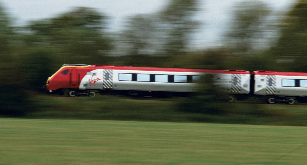 A high-speed Virgin Trains commuter train that travels between England and Scottland is shown i ...