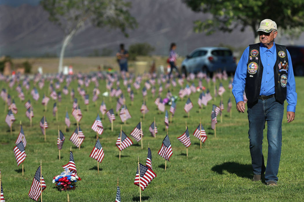 U.S. Navy veteran Michael Schuenke walks the Southern Nevada Veterans Memorial Cemetery in Boul ...