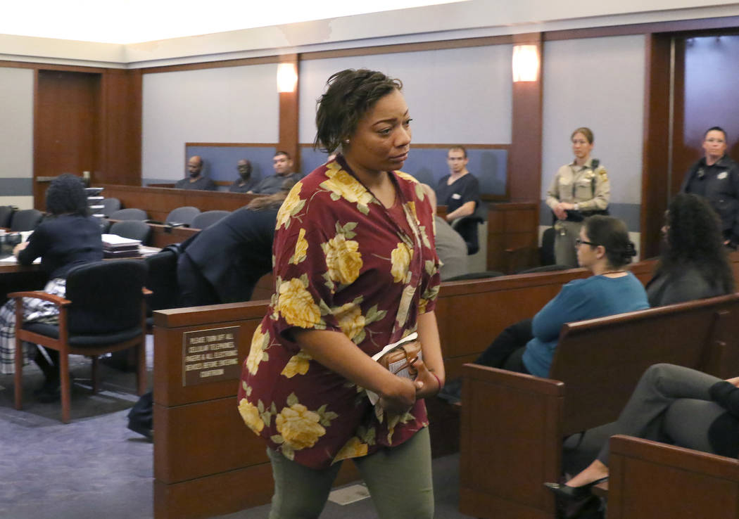 Cadesha Bishop, 25, accused of shoving a 74-year-old man off a bus, leaves the courtroom after ...