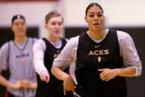 Aces center Liz Cambage, right, with JiSu Park, left, and forward Carolyn Swords during practic ...