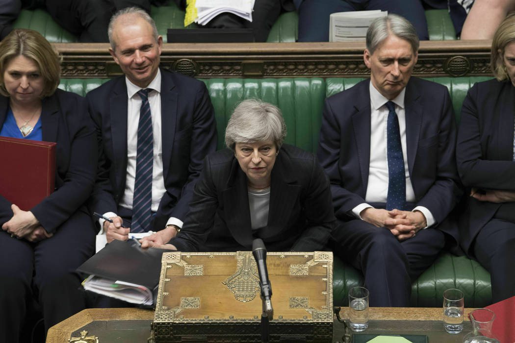 In this image made available by UK Parliament, Britain's Prime Minister Theresa May speaks duri ...