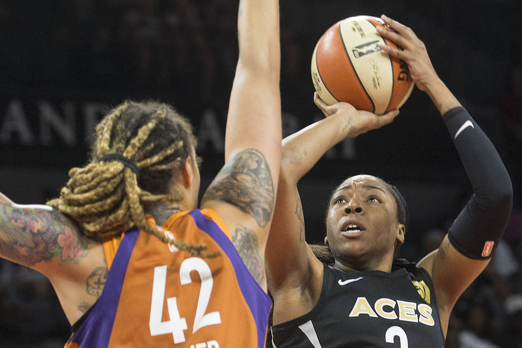 Aces center Kelsey Bone (3) shoots over Phoenix Mercury center Brittney Griner (42) in the firs ...