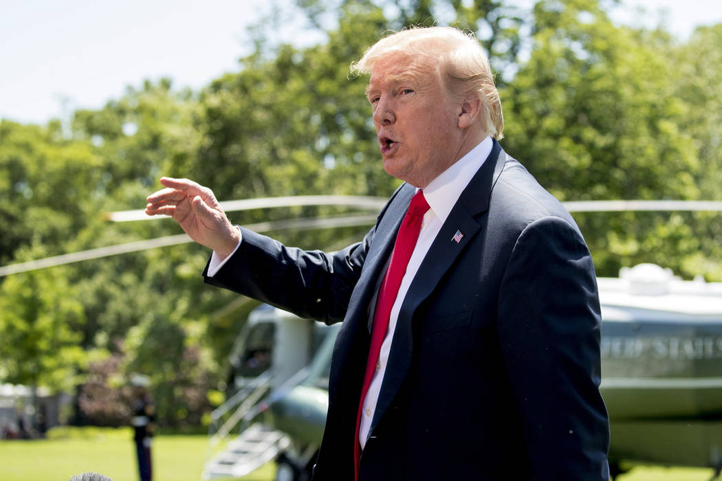 President Donald Trump speaks to members of the media on the South Lawn of the White House in W ...