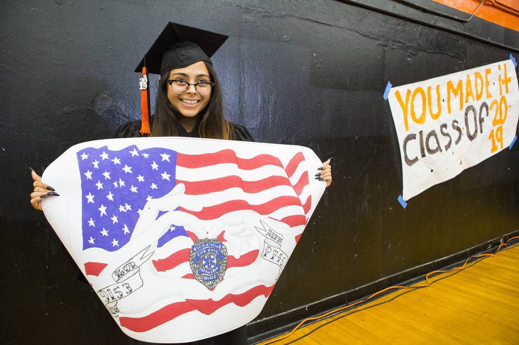 Cassandra Sosa shows off her winning mural during a graduation ceremony rehearsal at Chaparral ...