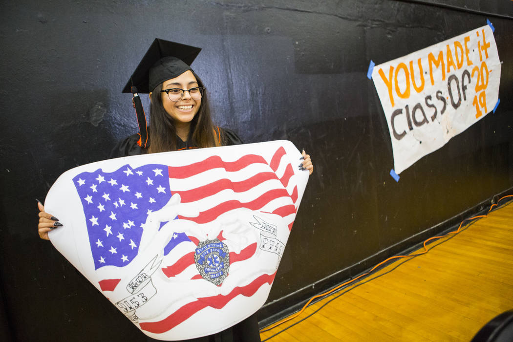 Cassandra Sosa shows off her winning mural during a graduation ceremony rehearsal at Chaparral ...