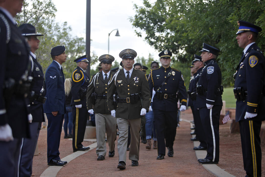 The honor guard walks to the front of the Southern Nevada Law Enforcement Officers memorial ser ...
