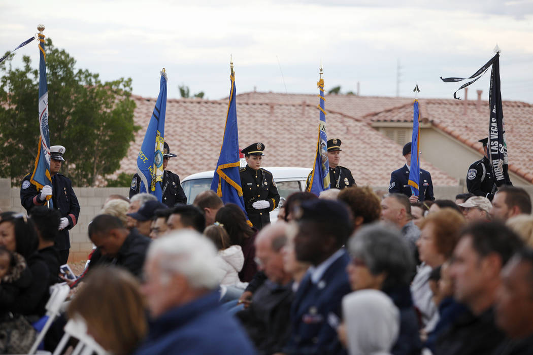 The flag detail stands over the crowd at the Southern Nevada Law Enforcement Officers memorial ...