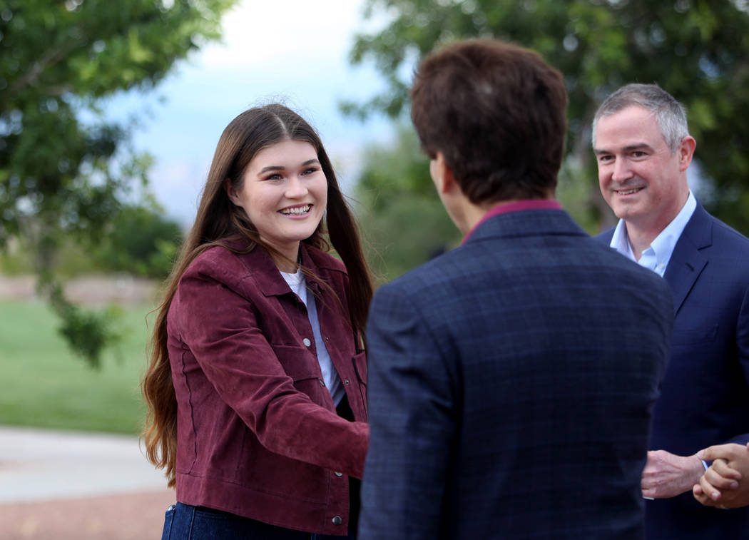 Kirsten Kircher, 18, shakes hands with Ron Coury, co-owner of Henderson Kia, Las Vegas Metropol ...