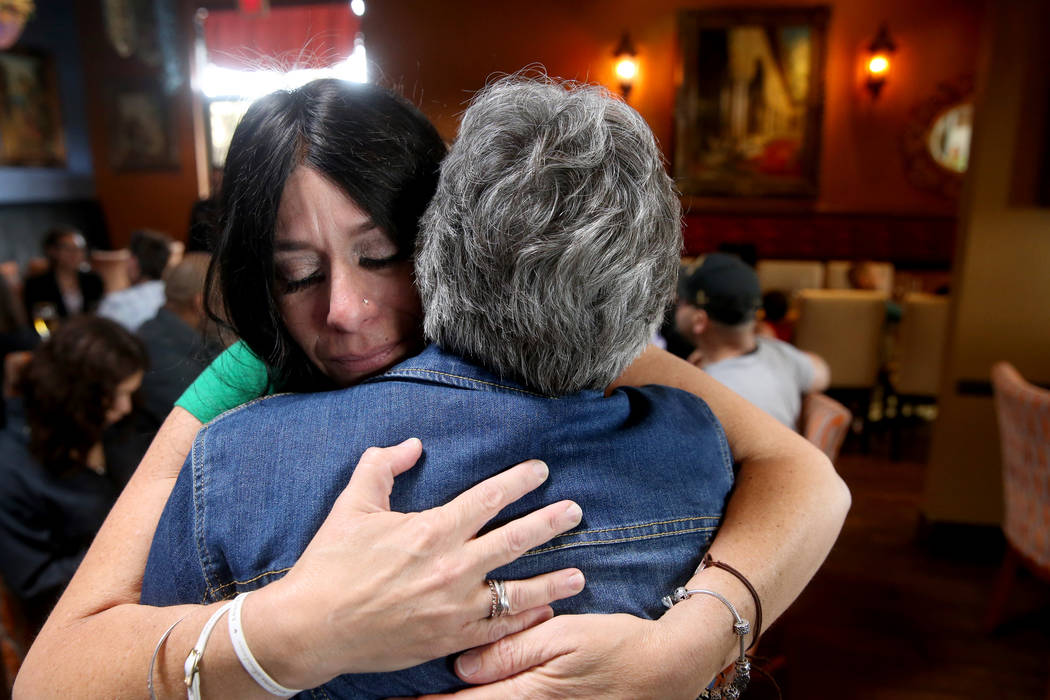 Courtney Kaplan, left, mother of Michael "Mikie" Sigler, the Cimarron-Memorial High S ...