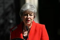 Britain's Prime Minister Theresa May makes a statement outside at 10 Downing Street in London, ...