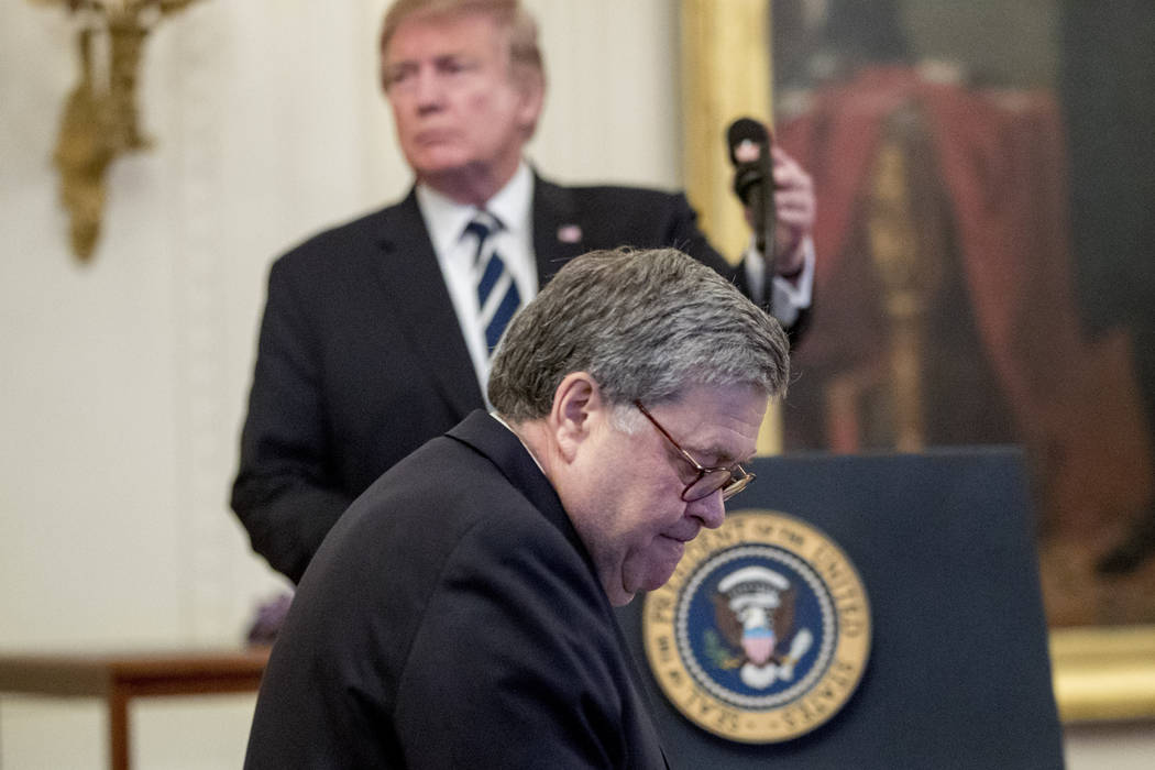 President Donald Trump takes the podium as Attorney General William Barr walks to his seat duri ...