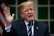 President Donald Trump delivers a statement in the Rose Garden of the White House, Wednesday, M ...