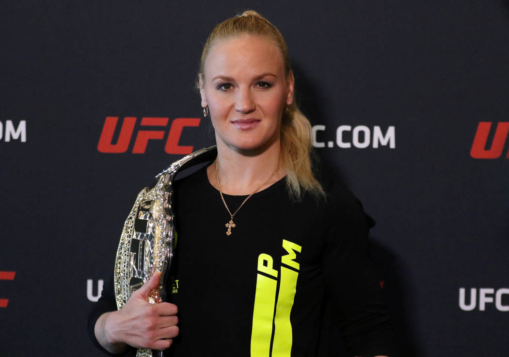 UFC women's flyweight champion Valentina Shevchenko poses with her belt at a media event at the ...