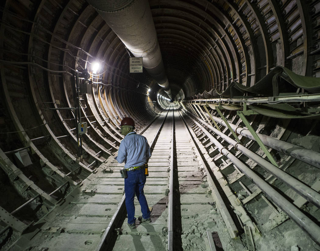 U.S. Rep. Greg Walden, R-Ore., walks through a tunnel extending from the south portal during a ...
