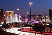 The Las Vegas Strip is lit up as traffic passes along Interstate 15. (Las Vegas Review-Journal)