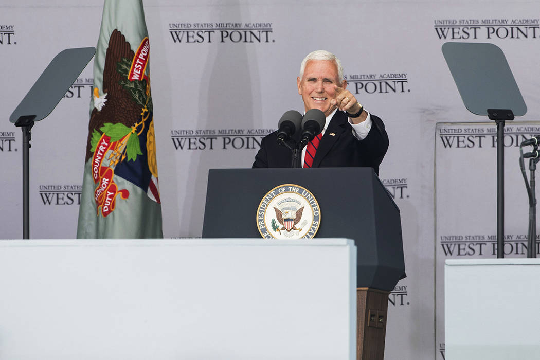 Vice President Mike Pence gestures to a cadet as he speaks during graduation ceremonies at the ...