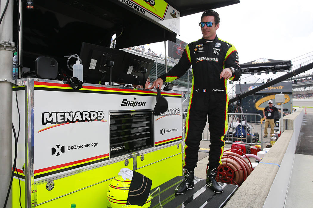 Simon Pagenaud, of France, stand on the pit wall following the final practice session for the I ...