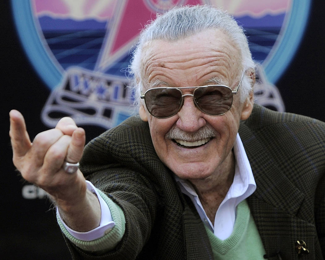 In this Jan. 4, 2011 file photo, Comic book creator Stan Lee strikes the Spiderman pose as he p ...