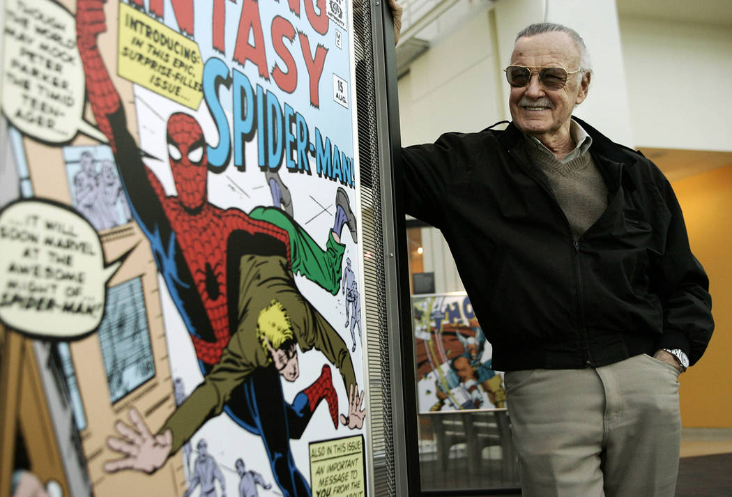 In this March 21, 2006 file photo, comic book creator Stan Lee stands beside some of his drawin ...