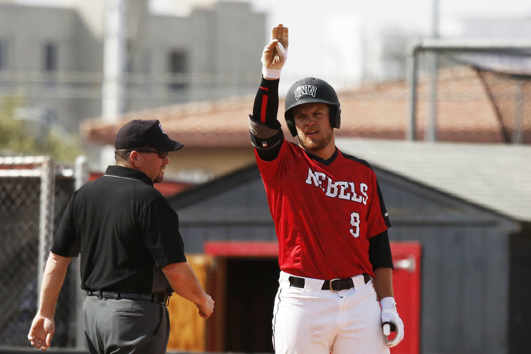 UNLV'S outfielder Max Smith (9) signals to his team after hitting a triple against Air Force at ...