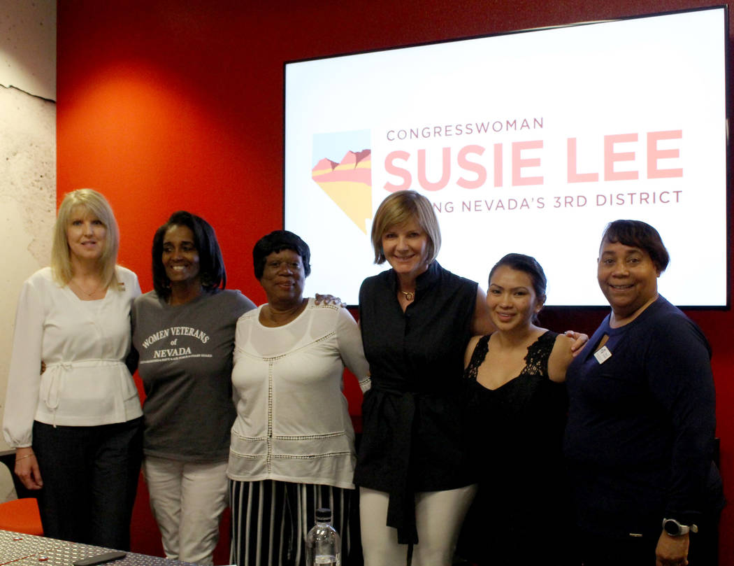 Rep.Susie Lee, D-Nev., center, poses for a photo with women veterans, from left to right, Air F ...