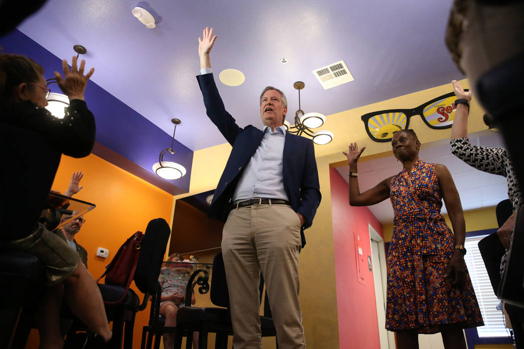 New York Mayor Bill de Blasio, center, a Democratic presidential candidate, with his wife Chirl ...