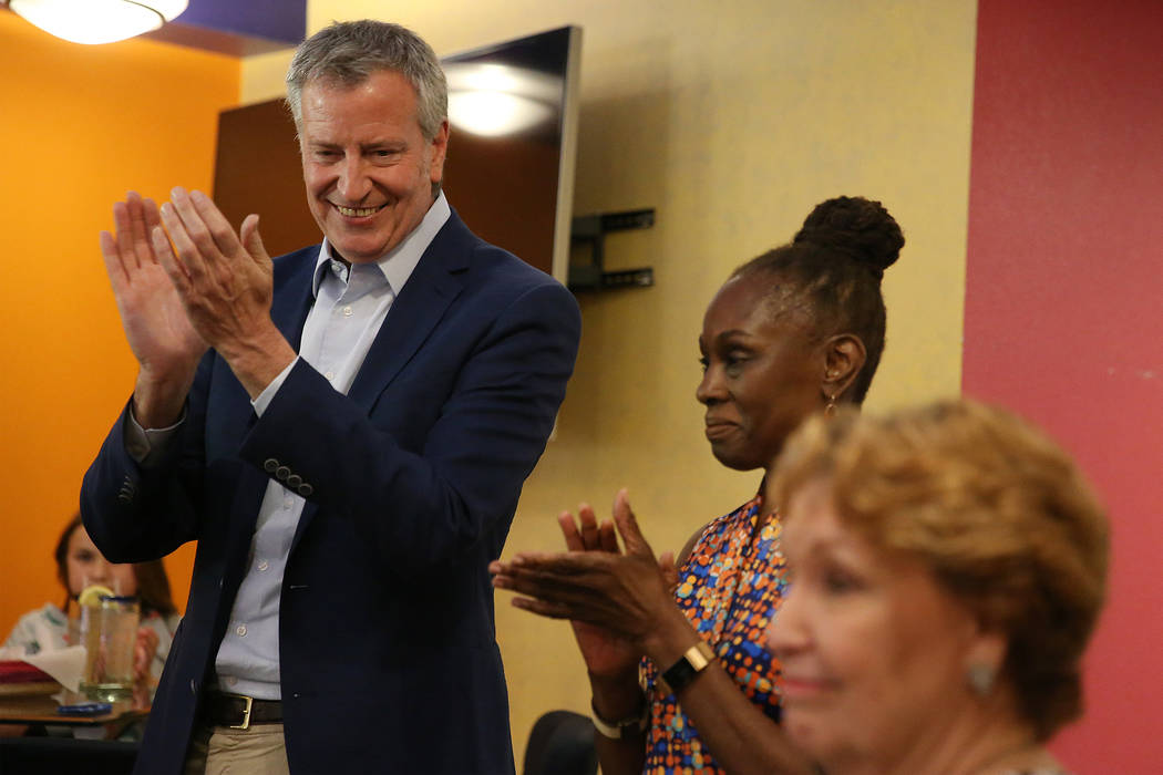 New York Mayor Bill de Blasio, left, a Democratic presidential candidate, with his wife Chirlan ...