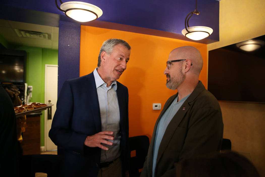 New York Mayor Bill de Blasio, left, a Democratic presidential candidate, meets Brian Shepherd, ...