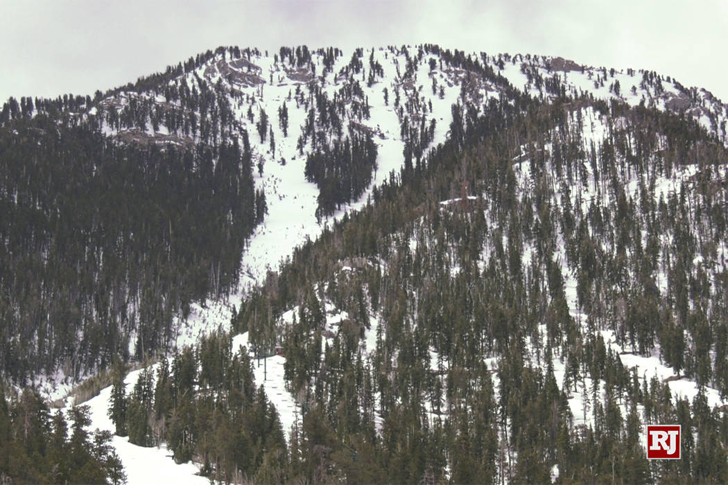 The eaks of Mount Charleston and Lee Canyon Ski area are covered in early morning snow Sunday, ...