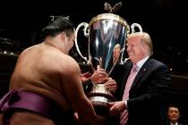 President Donald Trump presents the "President's Cup" to the Tokyo Grand Sumo Tournam ...