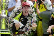 Simon Pagenaud, of France, celebrates after winning the Indianapolis 500 IndyCar auto race at I ...