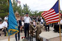Ed Davis, a members of the Special Forces Association, salutes during a ceremony honoring speci ...