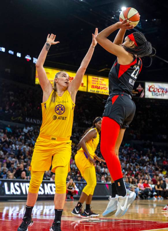 Los Angeles Sparks forward/center Maria Vadeeva (7) attempts to defend a shot by Las Vegas Aces ...