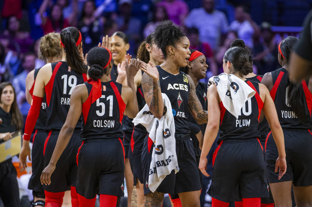 Las Vegas Aces forward Tamera Young (1) and teammates celebrate their win over the Los Angeles ...