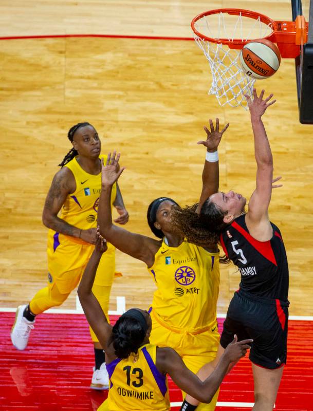 Las Vegas Aces forward Dearica Hamby (5) lays in the ball over Los Angeles Sparks center Kalani ...