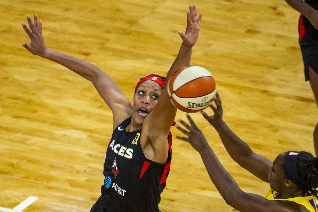 Las Vegas Aces center A'ja Wilson (22) rejects a shot by Los Angeles Sparks guard Chelsea Gray ...