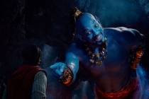 Mena Massoud as Aladdin, left, and Will Smith as Genie perform in Disney's live-action adaptati ...