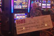 Las Vegas resident Christiene H. shows off her winnings Saturday, May 25, 2019, after she hit I ...