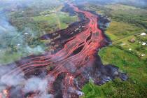 In this Saturday, May 19, 2018, photo released by the U.S. Geological Survey, lava flows from f ...
