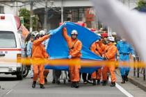 Rescuers work at the scene of an attack in Kawasaki, near Tokyo Tuesday, May 28, 2019. A man wi ...