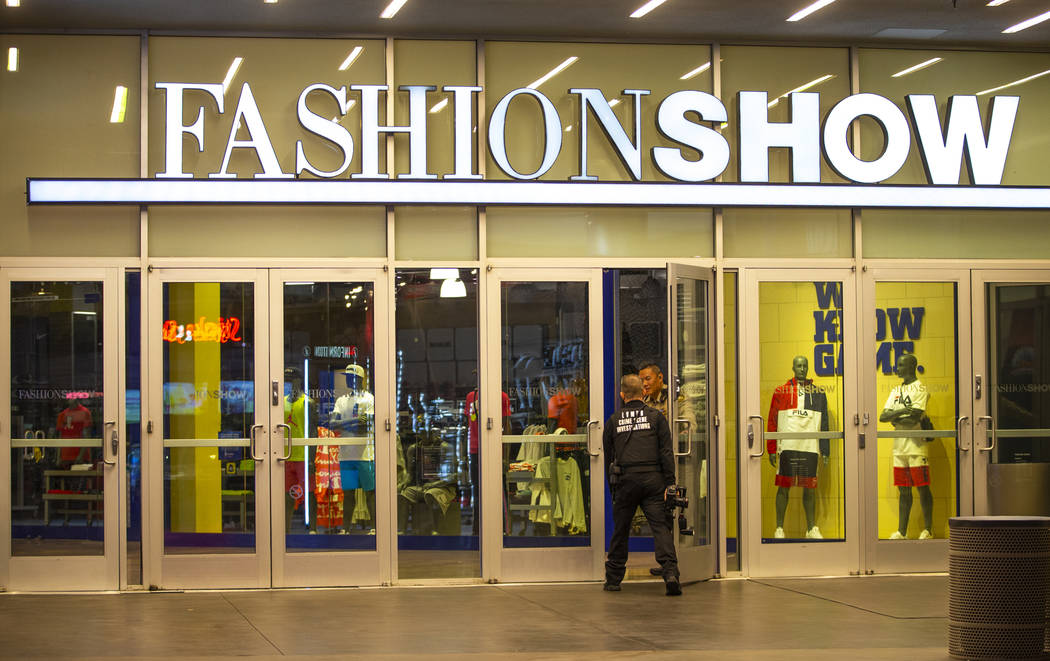 An LVMPD crime scene investigator enters the Fashion Show mall on the Strip after the mall was ...