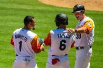 (From right) Aviators manager Fran Riordan (39) shares a laugh with base runners Beau Taylor (6 ...