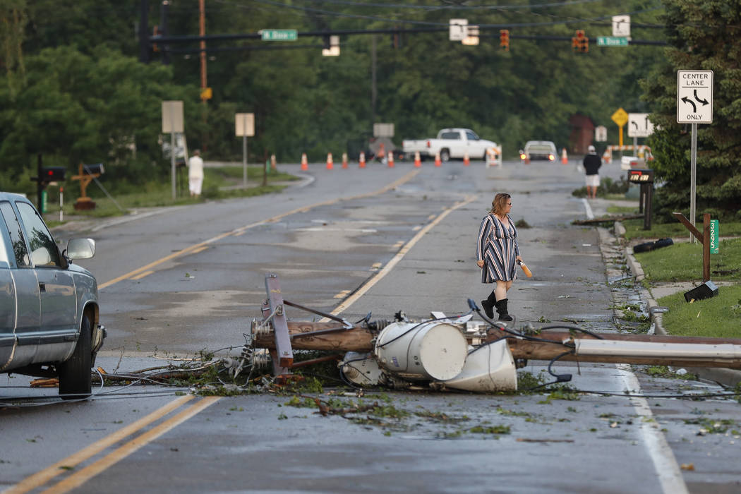 Storm damage litters a residential neighborhood, Tuesday, May 28, 2019, in Vandalia, Ohio. A ra ...