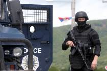 Kosovo police special unit members secure the area near the village of Cabra, north western Kos ...