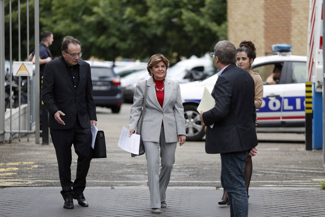American lawyer Gloria Allred, center, arrives to give a press conference, in Paris, Tuesday, M ...