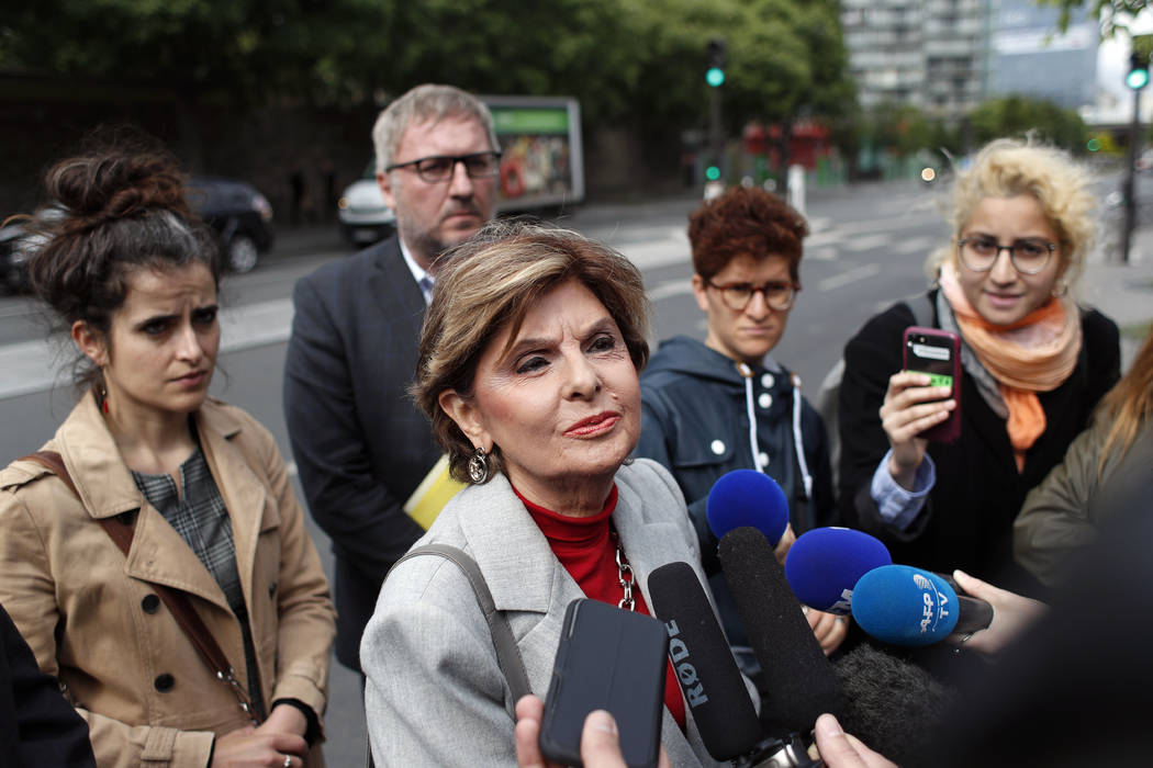 American lawyer Gloria Allred, center, gives a press conference, in Paris, Tuesday, May 28, 201 ...