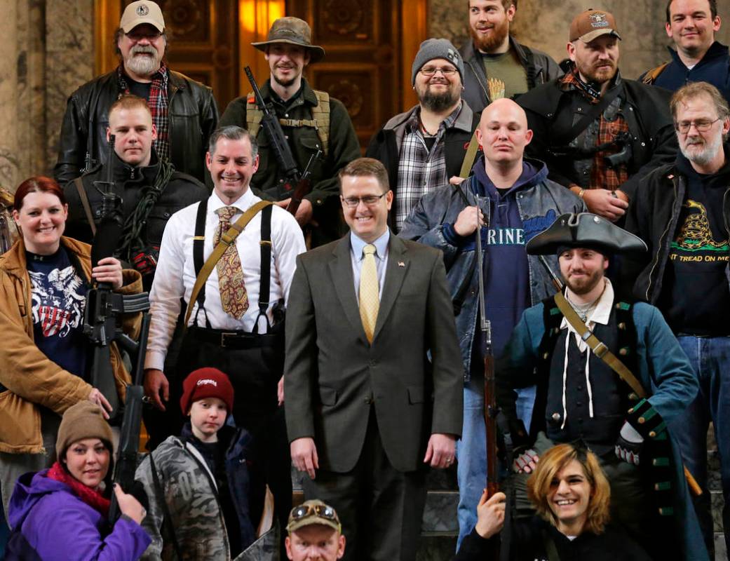 FILE - In this Jan. 15, 2015, file photo, Washington Rep. Matt Shea, R-Spokane Valley, center, ...
