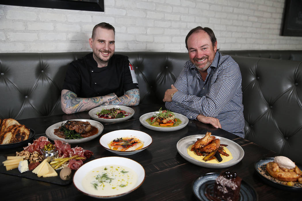 Executive chef Jackson Stamper, left, and restaurant owner Lance Johns, pose inside the Kitchen ...