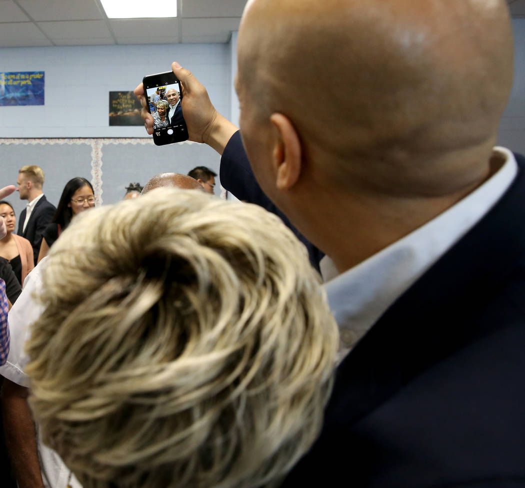 Presidential hopeful Sen. Cory Booker, D-N.J., takes a selfie with Ann Marie Gatling of North L ...